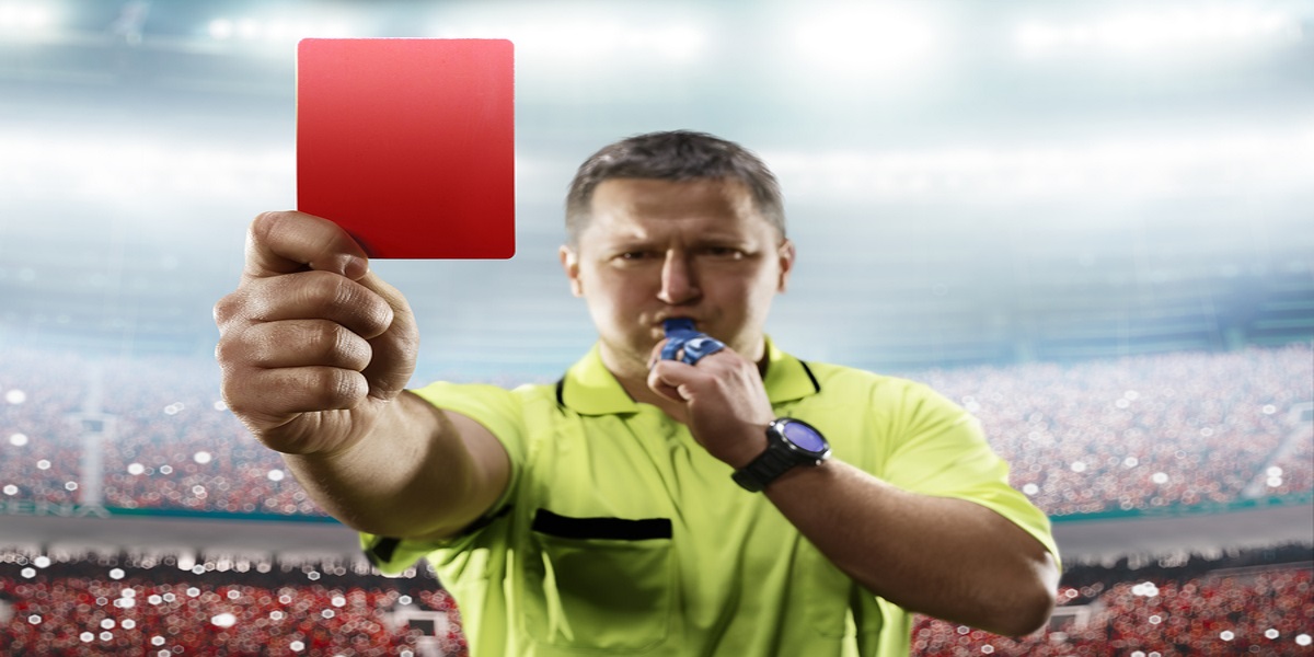 Photo of a football referee showing the red card to HMRC at the conclusion of their tribunal