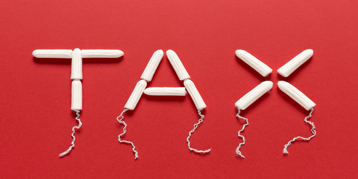 Photo of the word tax made out of tampons,on a red background.